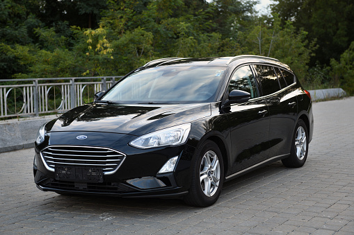 Belarus, Minsk - 23.09.2022: Black 2019 Ford Focus parked on the street in the city. Focus is one of the most popular compact cars.