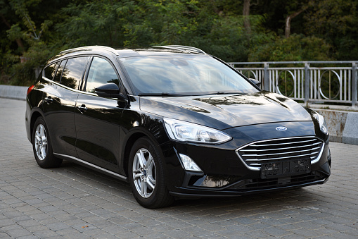 Belarus, Minsk - 23.09.2022: Black 2019 Ford Focus parked on the street in the city. Focus is one of the most popular compact cars.