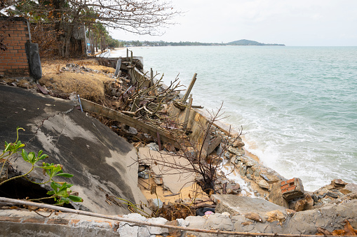 broken beach access after strong storm and high waves on Koh Samui Mae Nam Beach