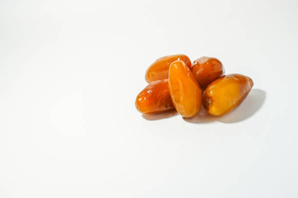istock Fresh ripe yellow dates, fresh dates ruthob isolated on white background 1456809120