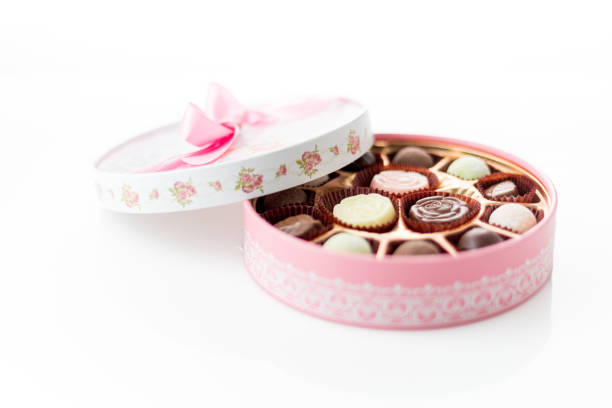 istock Chocolates in pink box on white background 1456809138