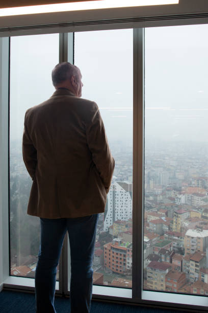 Businessman looking out the office window