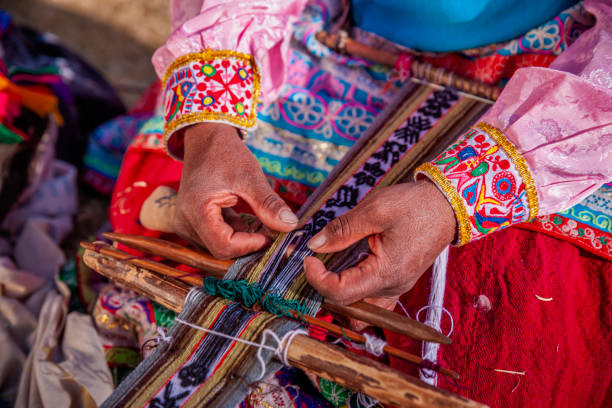 istock Peruvian woman weaving near Colca Canyon, Peru 1456809541