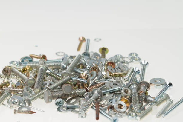 istock Screws, nuts, and bolts on isolated white background 1456809676