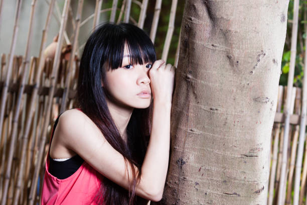 Taiwanese Asian young woman looking sad