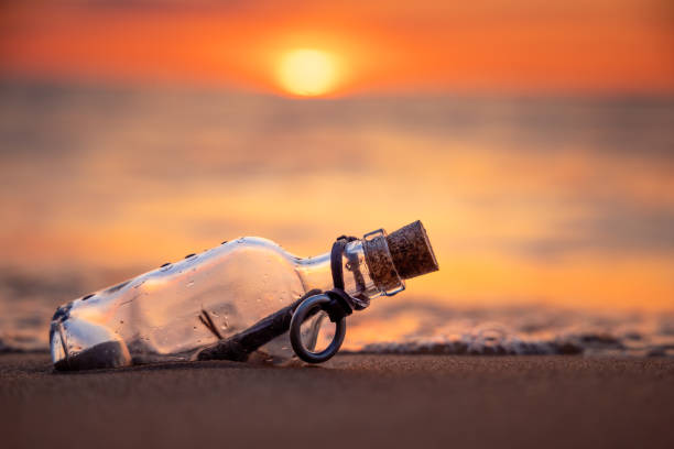 istock Message in the bottle against the Sun setting down 1456809917