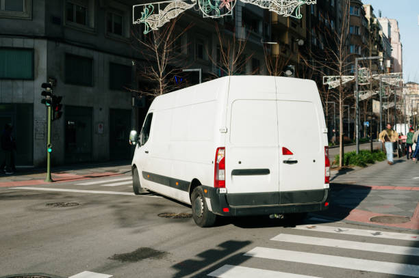 istock Large white van in a city street 1456812413