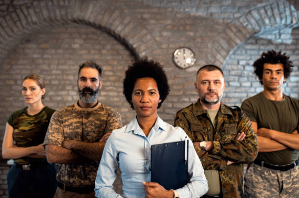 istock Portrait of diverse veterans at PTSD support group. 1456813380