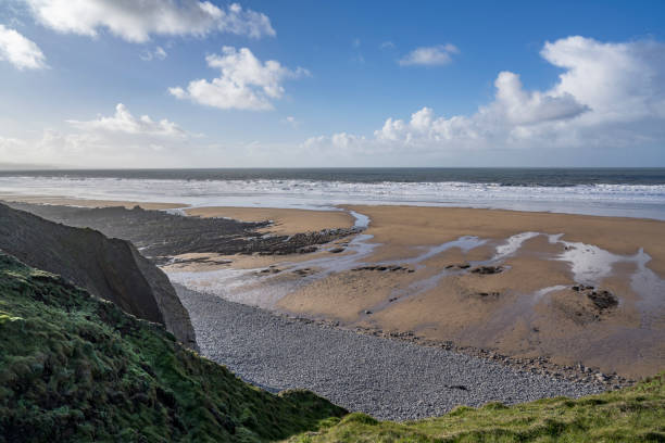 istock Low sunshine over Sandymouth beach 1456813661