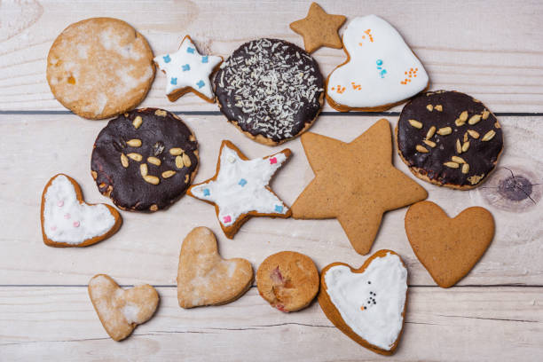 istock Handmade gingerbread cookies with icing of various shapes lie on the table. Flat lay 1456814032