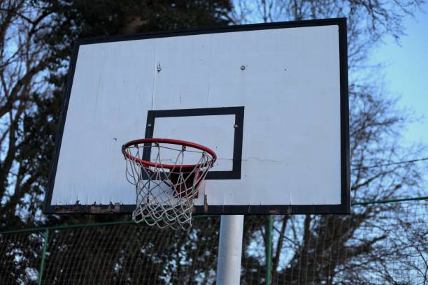 istock Basketball backboard with red hoop photo from the front 1456816131