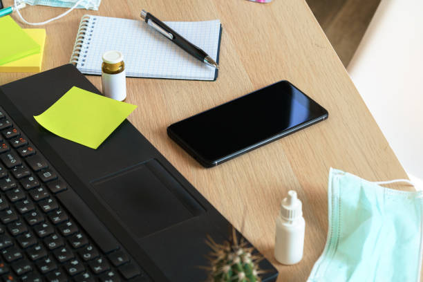 istock Medicine bottle on an office table with laptop 1456817555