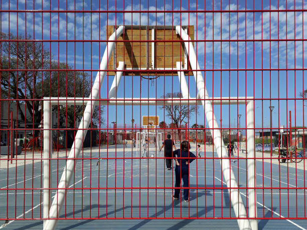 Montevideo, Uruguay - September 4, 2012: People playing at public sports court, ciudad vieja neigborhood, montevideo, uruguay