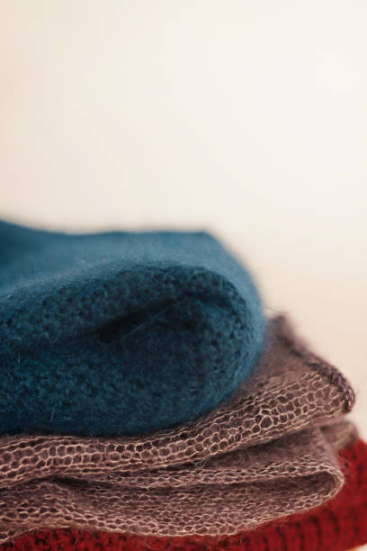 istock A stack of knitted woolen products lies on a wooden stool 1456820184