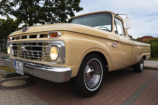 Preetz, Germany, August 07 2022, Ford twin I beam, F 100 custom cab pickup truck on a classic car show