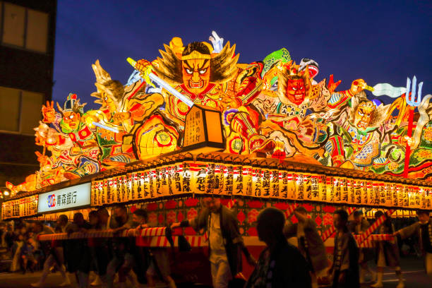 AOMORI, JAPAN - AUGUST 5: A lighted float is carried during a parade at the Aomori Nebuta Festival on August 5, 2022 in Aomori, Japan. Aomori Nebuta Festival is a summer festival held from August 2 to 7 in Aomori City, Aomori Prefecture. It is considered one of the three major festivals in Tohoku. It was the first time in three years that the festival was held due to the COVID-19 pandemic.