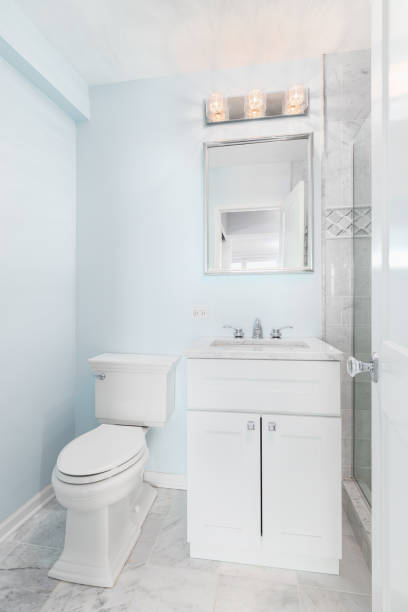 istock A blue bathroom with a white cabinet. 1456821605