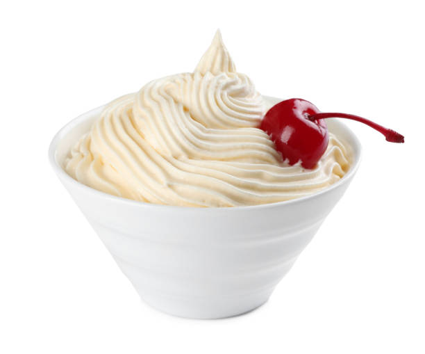 istock Delicious fresh whipped cream and cherry isolated on white 1456821657