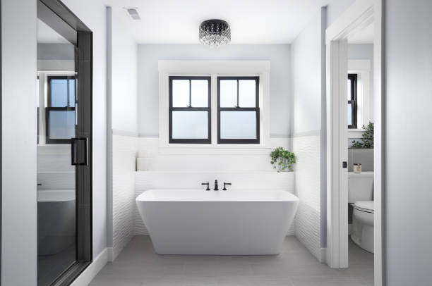 istock A bathroom with a light above a standalone tub and a walk-in shower. 1456821732