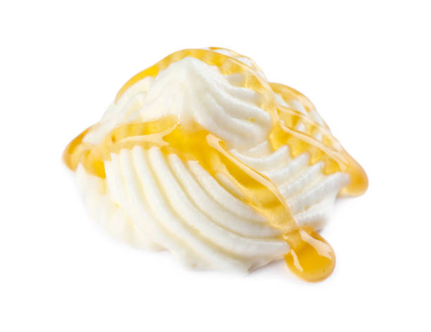 istock Delicious fresh whipped cream with caramel sauce isolated on white 1456821813