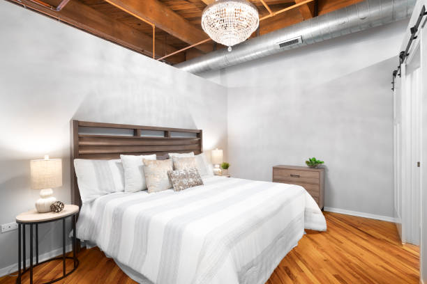 istock A loft bedroom with a chandelier hanging above the bed. 1456821839