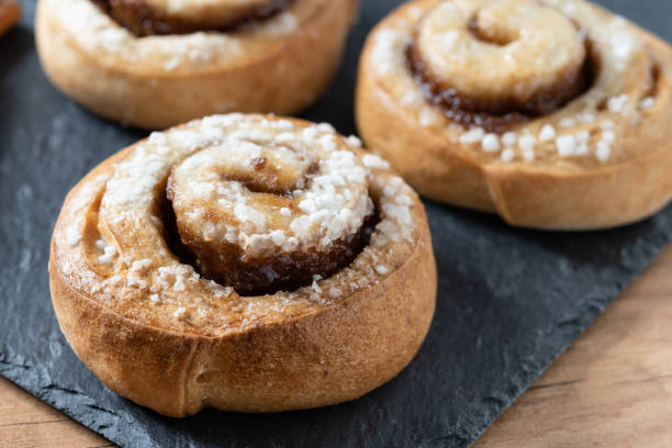 istock Cinnamon rolls buns on wooden table. Kanelbulle Swedish dessert 1456822058