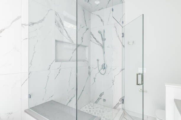 istock A marble walk-in shower with chrome shower head. 1456822064