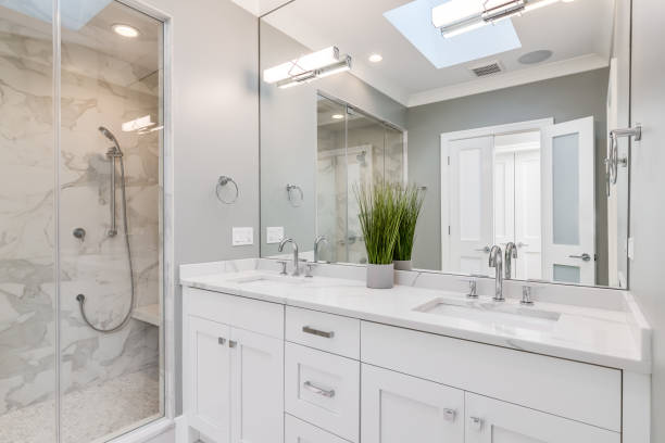 istock A bathroom with a white cabinet and brown marble tiled shower. 1456822774