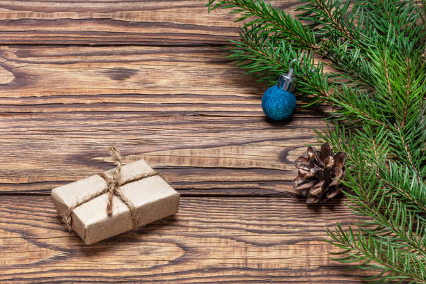 istock New Year's composition from a fresh Christmas tree branch, a gift in craft paper and a New Year's toy. 1456822829