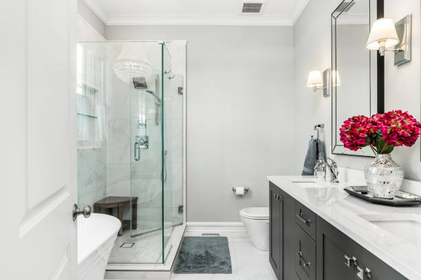 istock A bathroom with a grey cabinet, shower and standalone tub. 1456822886