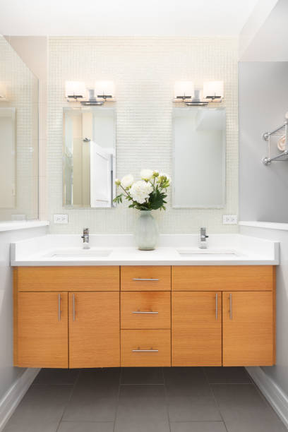 istock A bathroom with a floating wood cabinet and tiled backsplash. 1456822950