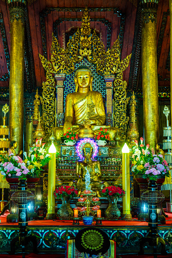 Old Buddha statue in Nantaram temple, Thailand.