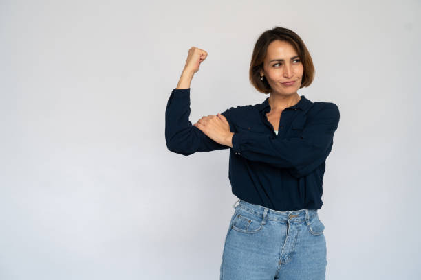 istock Confident Caucasian woman showing bicep 1456827487
