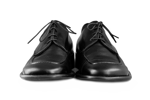 Elegant black men's shoes against a white background