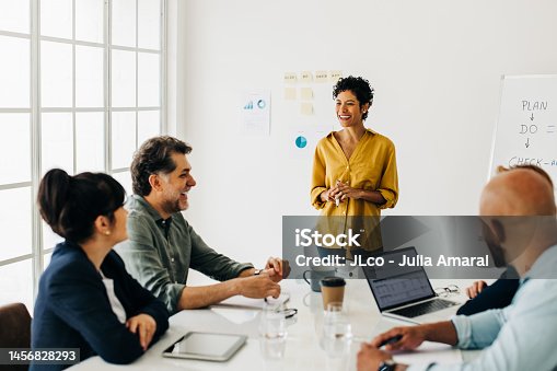 istock Diverse business people talking in a meeting. Business team having a discussion in a boardroom 1456828293