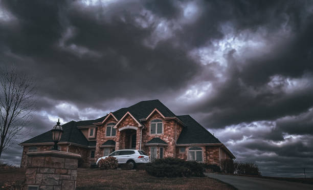 March 31, 2022, Manhattan, Kansas. A brick home stands out against a stormy sky. Many brick homes can be found in this area. These brick homes are not only pleasant to to see, they also stand as a symbol of strength against the harsh weather prone to the area.