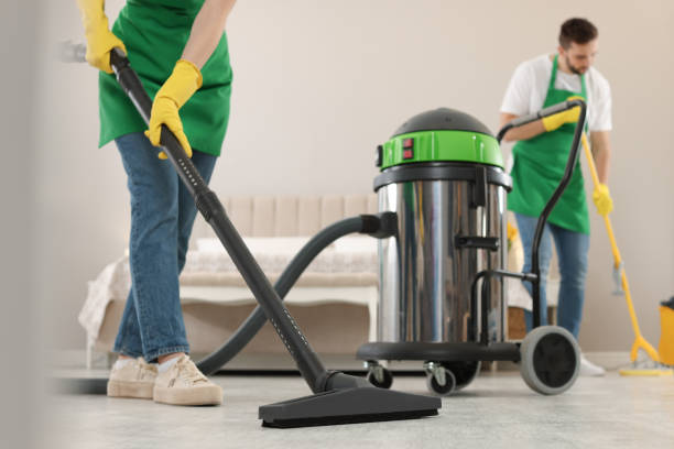 istock Professional janitors working in bedroom, closeup. Cleaning service 1456829709