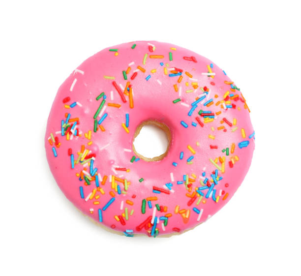 istock Sweet delicious glazed donut decorated with sprinkles on white background, top view 1456829863