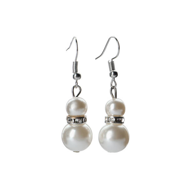istock Elegant earrings with pearls on white background 1456831758