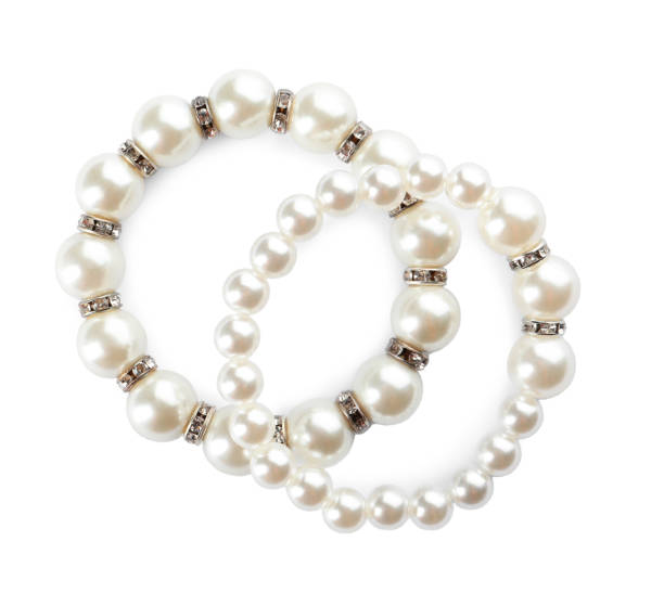 istock Elegant pearl bracelets on white background, top view 1456832631