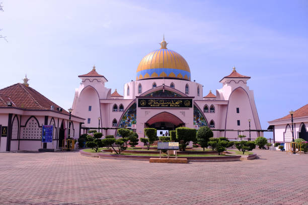 istock Front view of Melaka Straits Mosque, located on the man-made Malacca Island, which appears floating on the sea when there is a high tide. 1456833012