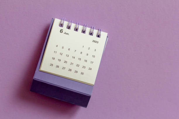 istock Desktop calendar for June 2023 on a lilac background. 1456833804