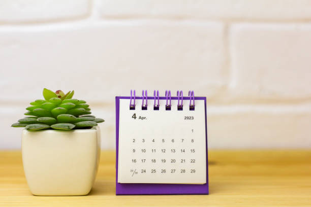 istock Desktop calendar for April 2023 for planning on the table. 1456833814