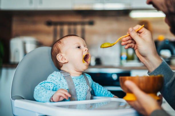 istock Cute little baby boy is hungry! 1456835184