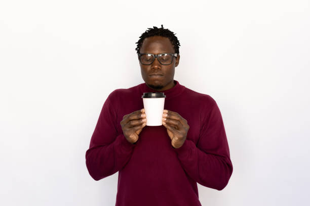 istock Calm man smelling coffee 1456835750