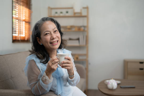 istock Senior asian woman drinking tea at home. 1456837023