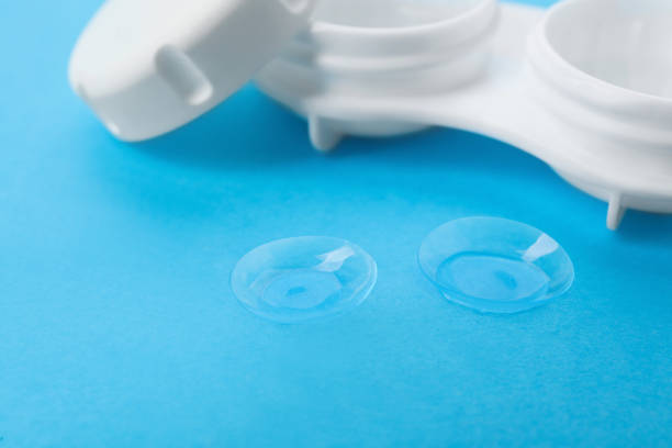 istock Contact lenses and case on light blue background, closeup 1456837993