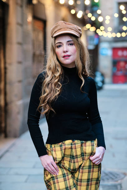 istock Blonde woman posing while looking at camera in the street 1456846453