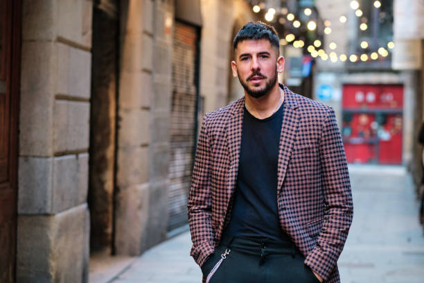 istock Beautiful man looking at the camera while posing outdoors 1456846458