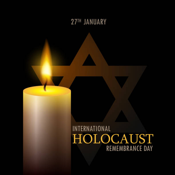 istock International holocaust remembrance day. One burning candle and star of David on black background. 1456846505